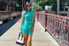 With black and white bag and turquoise flat sandals