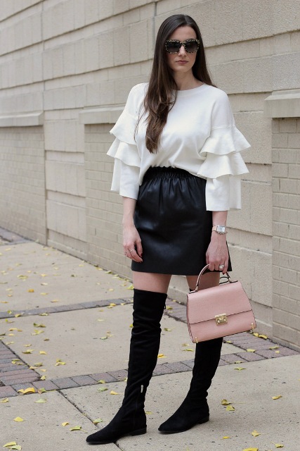 With black mini skirt, over the knee boots and pale pink bag