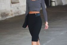 With black pencil skirt, cutout shoes and clutch