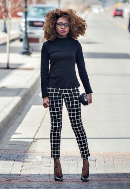 With black shirt, checked pants, clutch and pumps