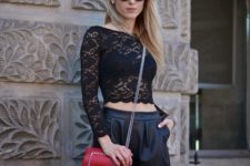 With black shorts and red bag