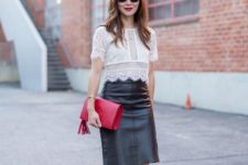 With black skirt, red clutch and red pumps
