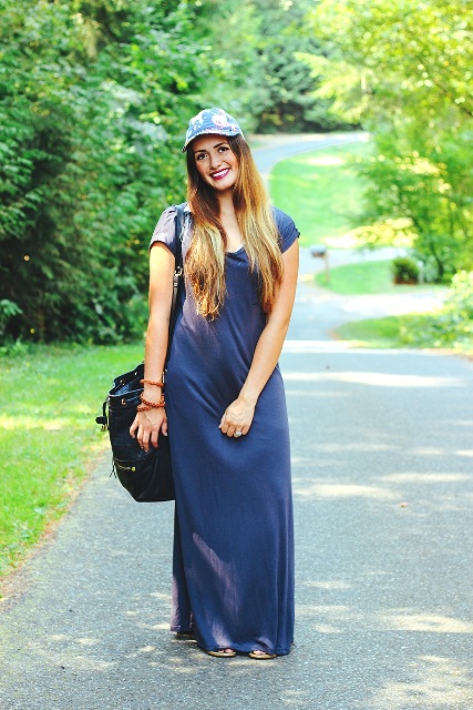With blue maxi dress and black bag