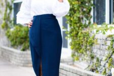 With blue midi skirt and blue pumps