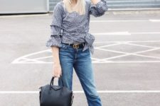 With checked blouse, jeans, black sandals and black bag