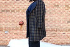 With checked coat and black pumps