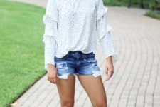 With denim shorts and black flat sandals
