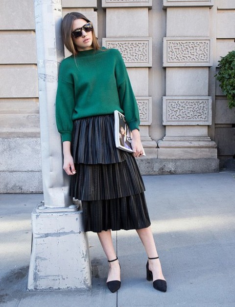 With emerald sweatshirt and black shoes