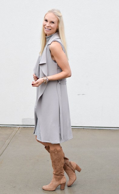 With gray dress and high boots