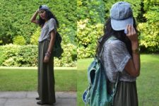 With gray loose shirt, maxi skirt and backpack