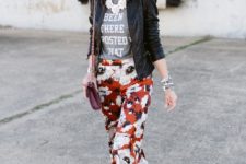 With gray t-shirt, black leather jacket, pumps, marsala mini bag and red hat