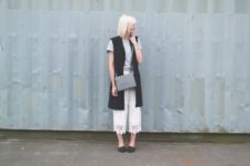 With gray t-shirt, long vest, gray bag and flats