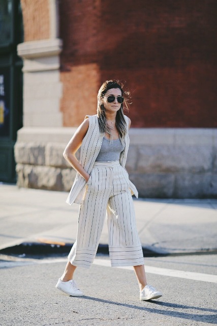 With gray top, striped vest and white sneakers