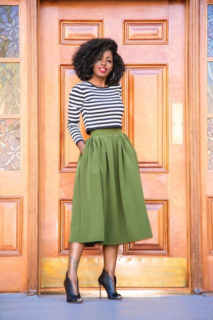 With green midi skirt and ankle boots