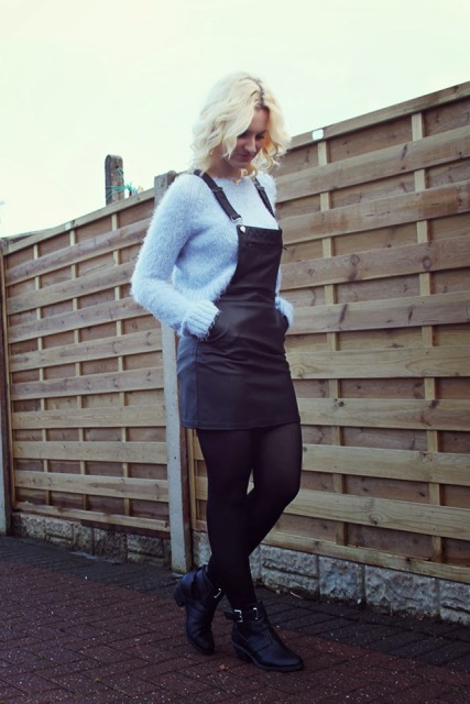 With light blue sweater, black tights and ankle boots
