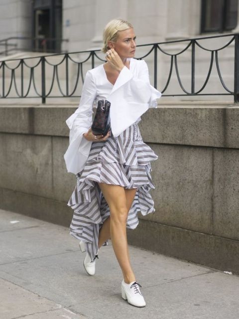 With striped ruffle skirt, white shoes and clutch