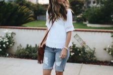With white blouse, brown sandals and fringe bag