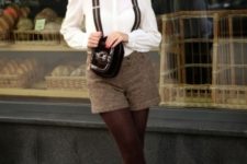 With white blouse, printed cap, tights, brown shoes and clutch
