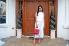 With white blouse, red pumps and red leather bag