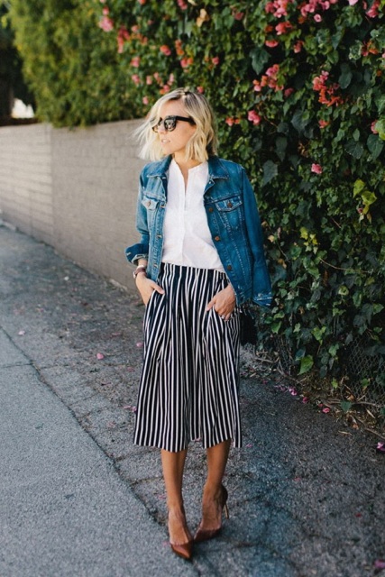 With white button down shirt, denim jacket and bronze pumps