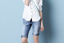With white button down shirt, hat, crossbody bag and sandals