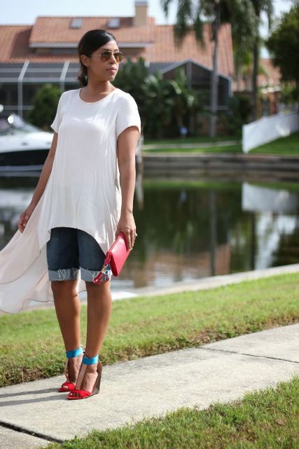 With white loose long t-shirt , colorful sandals and red clutch