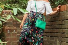 With white off the shoulder shirt, shoes and green bag