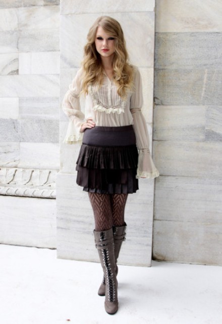 With white ruffle blouse and gray lace up boots