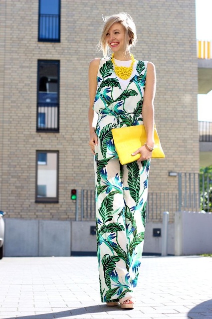 With white top, yellow necklace, yellow clutch and shoes
