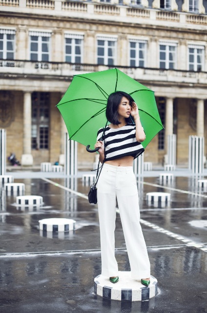 With white wide leg pants and green pumps