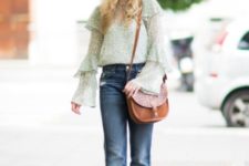 With wide leg jeans, brown leather bag and heels