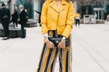 With yellow jacket, black high heels and black clutch