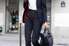 02 a black pantsuit with an oversized jacket, a white tee and flat shoes for a Parisian chic feel