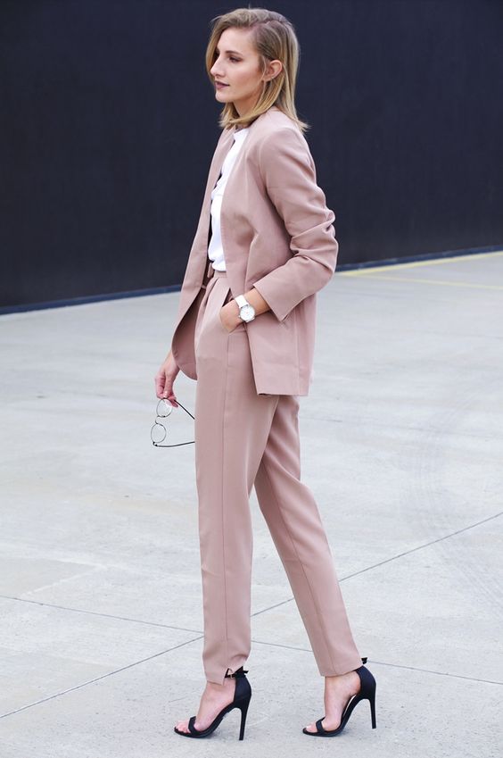a dusty rose pantsuit, black heels and a white shirt for a girlish work look