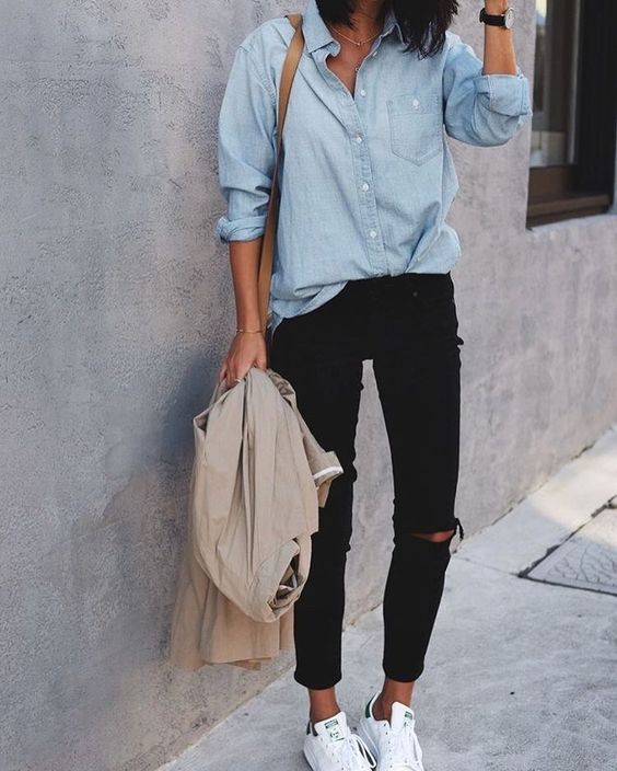 black ripped skinnies, a chambray shirt, white sneakers and a neutral jacket