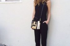 05 a black jumpsuit, black slipons and a black and white bag for a comfy modern work look