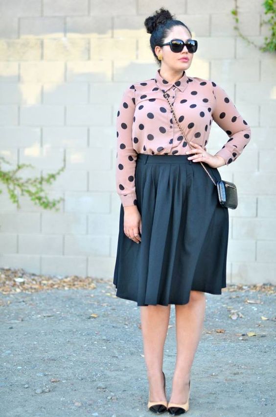 a black full knee skirt, a dusty pink polka dot shirt, blush and black heels for a girlish feel