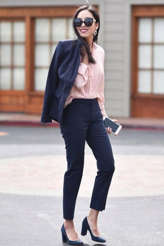 a navy suit with cropped pants, a blush blouse, navy shoes for a bold look
