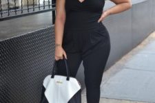 09 a black jumpsuit with spaghetti straps, cropped pants, blakc shoes and a black and white bag