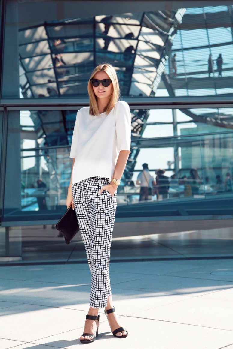a white tee, black and white windowpane pants, black ankle strap shoes and a clutch