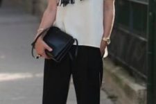 12 black pants, a white tee, a black scarf, black shoes and a bag for a casual work look