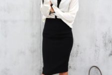 16 a black pencil skirt, a white and black shirt, black ankle strap shoes and a cool bag