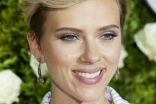 Scarlett Johansson rocking a long on top blonde pixie with a darker root looks sophisticated and very chic