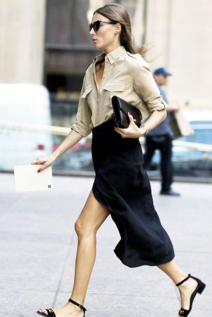 With beige button down shirt, midi skirt and clutch