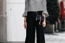 With black culottes, crossbody bag and black high heels
