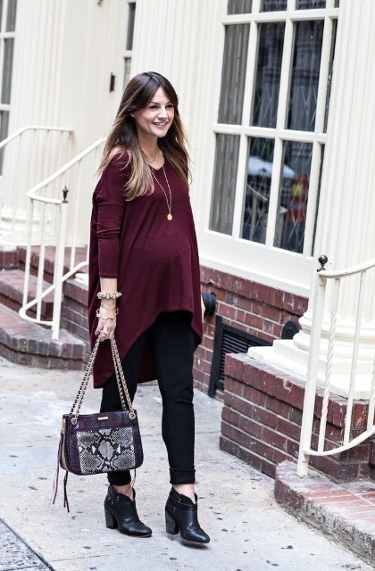With black leggings, ankle boots and printed bag