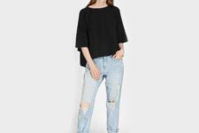 With black loose shirt and distressed jeans