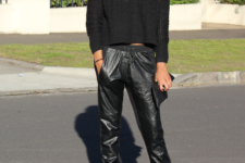 With black loose shirt, lace up shoes and clutch