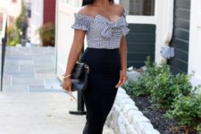 With black midi pencil skirt, clutch and red high heels
