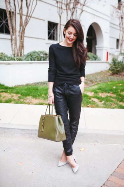 With black shirt, white pumps and olive green bag
